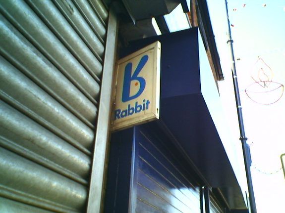 Rabbit signage outside a storefront.